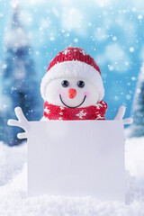 Happy snowman with blank christmas greeting card for your design. Christmas greeting card. Winter...