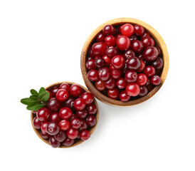 Bowls of ripe cranberries on white background