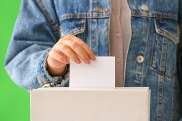 Voting woman near ballot box, closeup