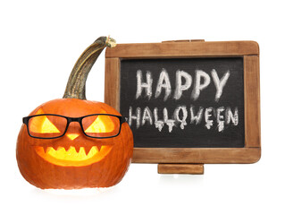 Chalkboard with text HAPPY HALLOWEEN and carved pumpkin on white background