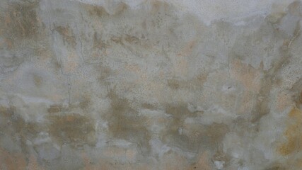 The old cement wall was weathered, the surface was scratched, the surface was scratched and damaged. For a mysterious retro-conservative background.