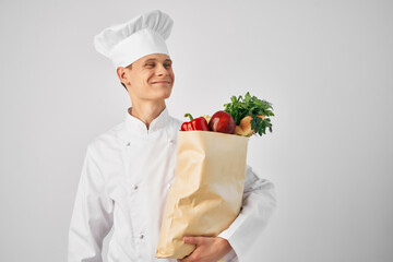 Chef with a package of groceries kitchen cooking food work