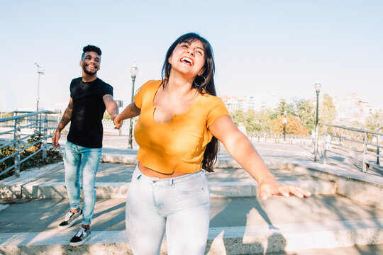 young couple in love. Two hispanic laughing together 