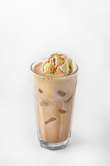 beautiful transparent glass of summer drink. coffee with ice cream and ice cubes isolated on a white background with natural shadows