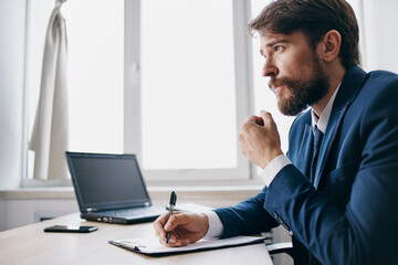Fototapeta premium manager working for a laptop in the office emotions technologies