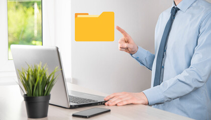 Businessman hold folder icon.Document Management System or DMS setup by IT consultant with modern computer are searching managing information and corporate files.Business processing,