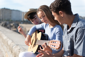 Group of teenagers with a guitar