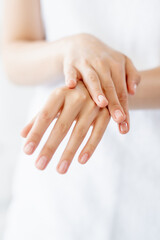 Naklejka premium Nail care. Hand manicure. Beauty care. Closeup of woman elegant gentle palms with slender feminine fingers isolated on white background.