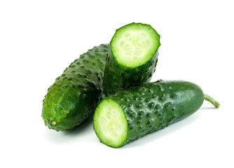 Close-up of Two whole fresh green cucumbers and slices isolated on white background..