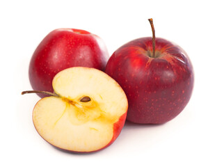 Red apple with slice on a white background.