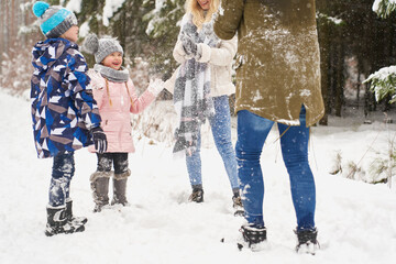 Family playing outdoors at winter