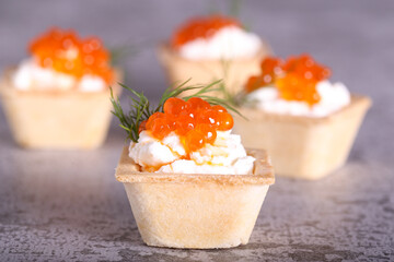 canapes with red caviar and cheese for the New Year's table