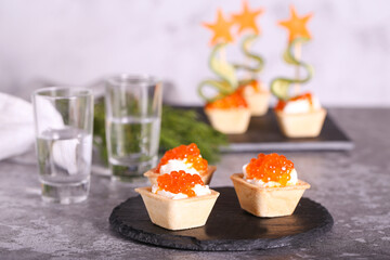 canapes with red caviar and cheese for the New Year's table