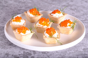 canapes with red caviar and cheese for the New Year's table