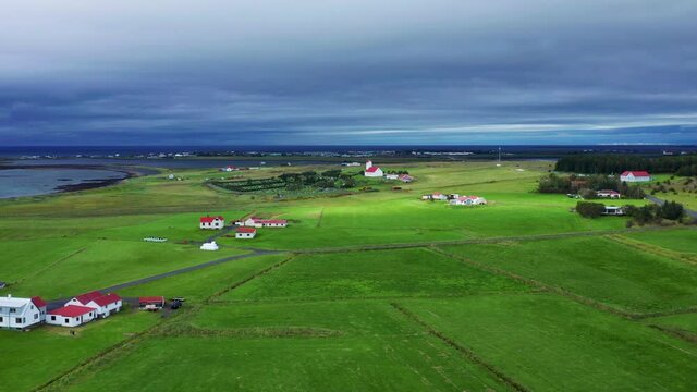 Distant View Of Gardakirkjugardur Cemetery And Gardakirkja Church In Gardabaer, Southwest Iceland. aerial