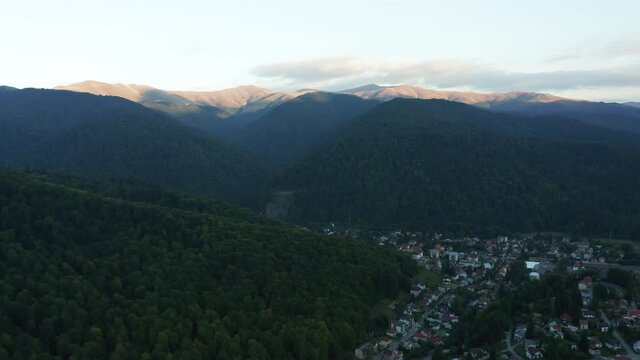 Aerial push in landscape of Busteni and Baiu Mountains, Romania