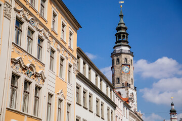 Obraz premium Goerlitz, Saxony, Germany, 04 September 2021: Historical Town hall or Rathaus, antique clock with two dials and moon calender on tower at Lower Market Square or Untermarkt at sunny summer day