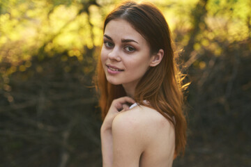 Naklejka premium attractive woman in white dress outdoors rest green leaves nature