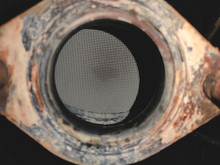 catalyst, vehicle exhaust gas neutralizer. Close-up view. Emission standards for harmful...
