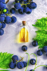 Grape seed oil in a bottle. Selective focus.