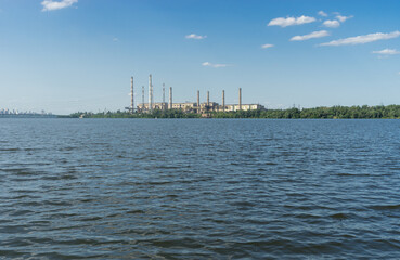 Summer  landscape with non working  electric power station beside Dnipro river in Dnipro city,...