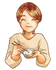 笑顔でお米を食べる女性