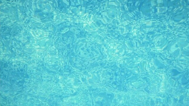 Celeste water moves kaleidocsopically in a fine swimming pool making traceries 