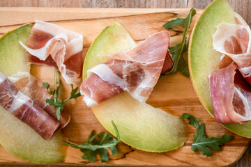 Sliced delicious prsut, national balkan smoked beef meat, surved with melon