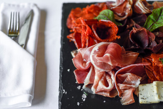 Sliced delicious prsut and kulen, national balkan smoked beef meat