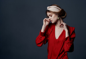 woman in red dress earrings headband fashion elegant style