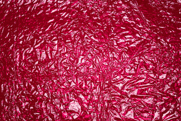 hot pink shiny reflective textured plastic background