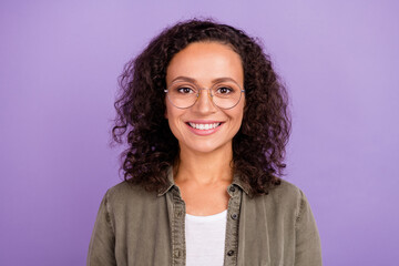 Photo of charming young happy afro american woman smile wear khaki shirt isolated on purple color...