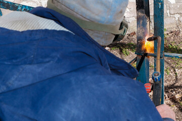 Welder uses gas welding at work