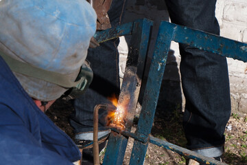 Welder uses gas welding at work