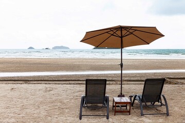 Empty sun beds at the beach of the hotel in relief of the epidemic