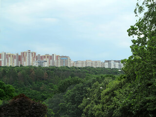 Fototapeta premium Newly built block of eco flats in middle of green forest