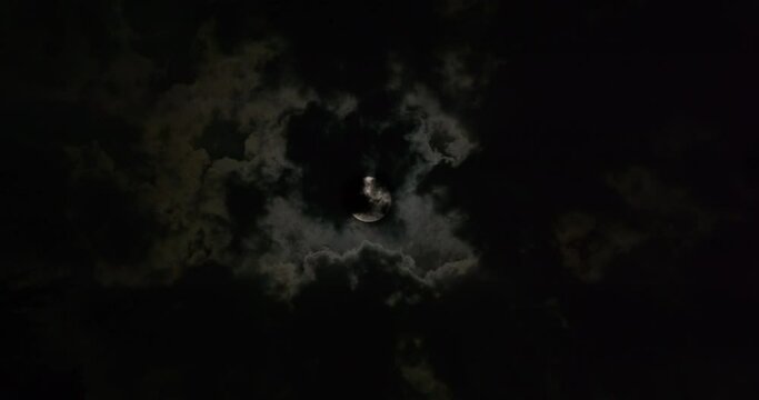 Full moon in the dark and cloudy night