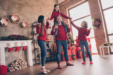 Photo of funky family father piggyback hold daughter hold hands tradition in decorated x-mas home indoors