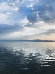 Blue surface of the lake, blue sky, azure lake background