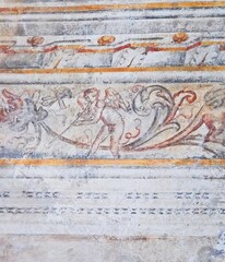 Angel making music fresco on a wall.  Beautiful Italian ancient artwork.  Historical Catholic art, European sanctuary, spiritual symbol.