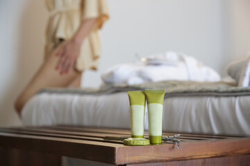 Woman using skin care products at home. Domestic life, home spa, self care and pampering concept.	