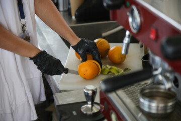 Making of fresh orange juice in bar