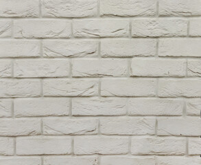 Horizontal brickwork is gray with damage. Gray background with brick texture. The old wall.

