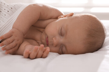 Cute little baby sleeping in bed, closeup