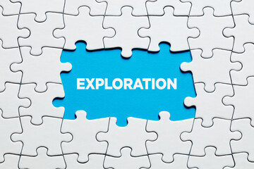 Fototapeta premium The word exploration surrounded by jigsaw puzzle. To explore or research in education, science or business marketing