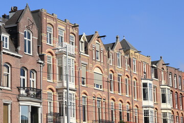 Fototapeta na wymiar Amsterdam Paulus Potterstraat Street House Facades Against a Blue Sky, Netherlands