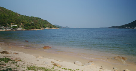 Sea wave over the sand beach