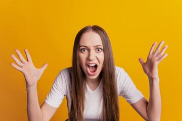 Photo of young girl negative angry scream conflict problem mad isolated over yellow color background