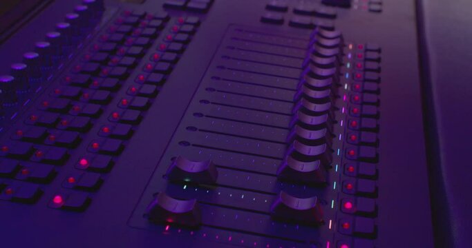 equalizers move on a modern digital audio mixer. sound equipment. close-up.