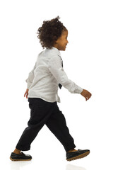 Walking small black boy in elegant clothes. Side view. Full length, isolated. - 462175237